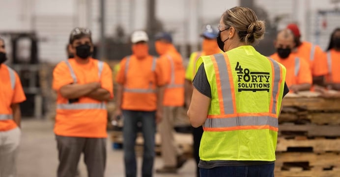 Pallet workers at a morning meeting