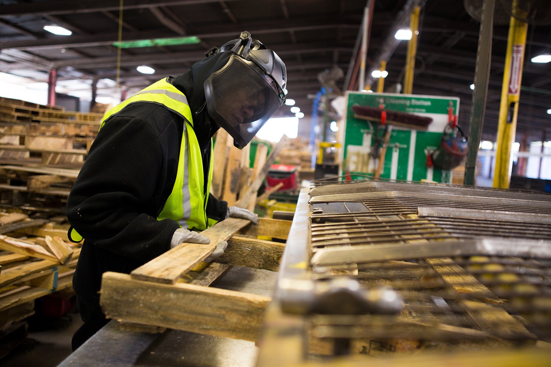 A worker working with a pallet