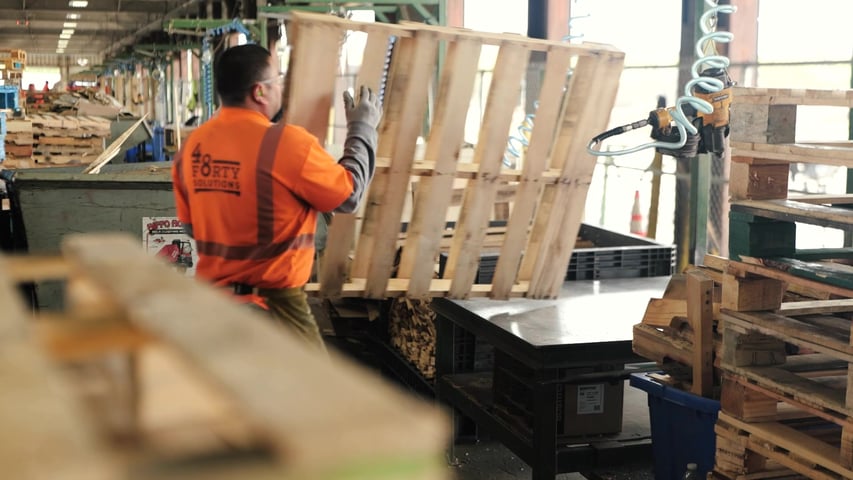 pallet builder working on a pallet